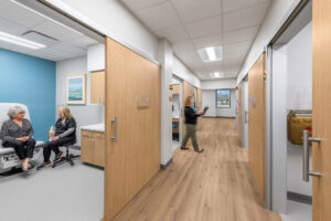 Patient and doctor sit behind the sliding door.