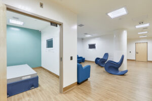 Lobby space that has a sitting area and a private sleeping area.
