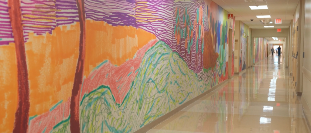 In Phoenix Children’s Hospital, a contemporary artist created a mural on more than 60 sheets of paper using crayons, markers, and watercolors to help the artwork feel more accessible to kids.