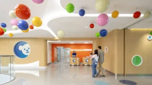A children's hospital room with bright, colorful objects filling the room.