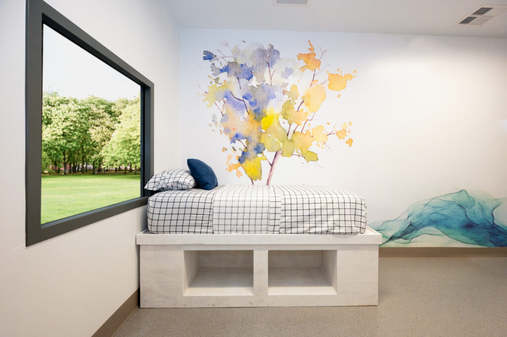 Featuring natural light, calming finishes, built-in sound therapy systems and privacy-conscious layouts, each unit creates an environment that supports emotional regulation and meaningful engagement.