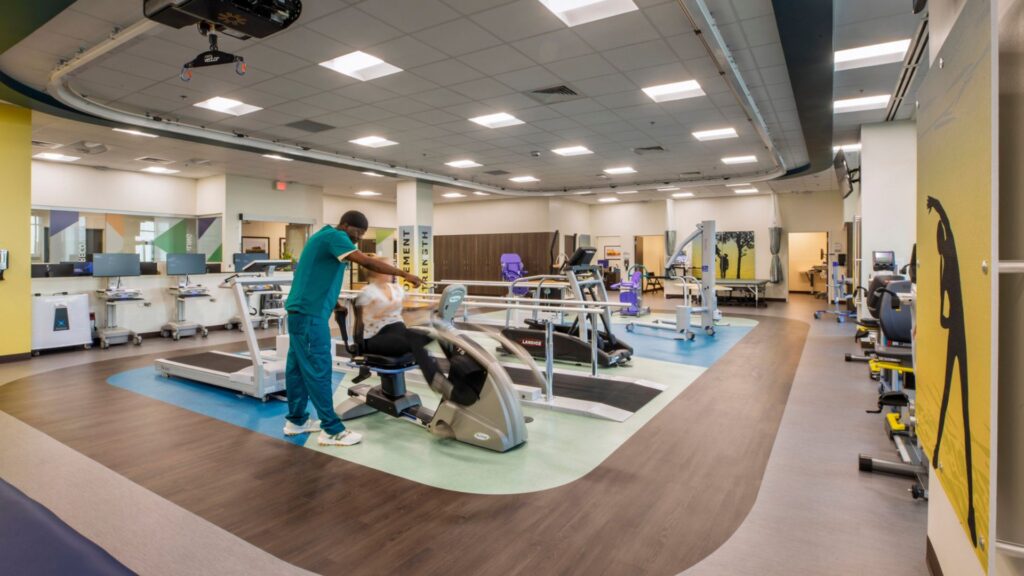The rehab gym at Wesley Rehabilitation Hospital in Wichita, Kansas, offers a light-filled space for physical therapy and patient recovery.