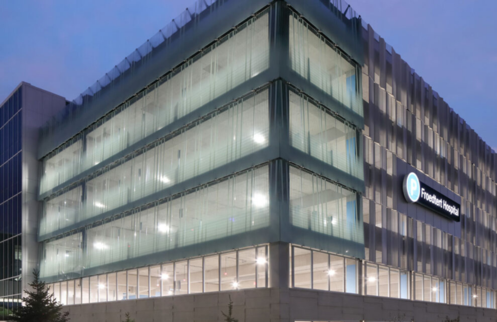 Bendheim ventilated glass along the façade of the Blue Parking Structure brightens the exterior and provides a visual cue, leading visitors toward the skybridge. Photo by Tricia Shay Photography