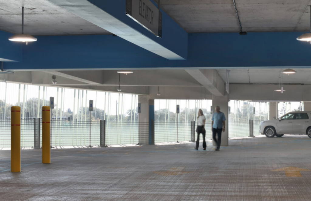  Inside the Blue Parking Structure, custom Bendheim ventilated glass helps bring natural light deeper into the space, improving visibility. Photo by Tricia Shay Photography