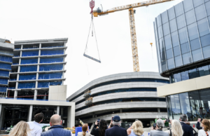With the buildings topped out, the organization said work will shift from structural construction to interior buildout as the hospitals take shape as patient-centered facilities. 