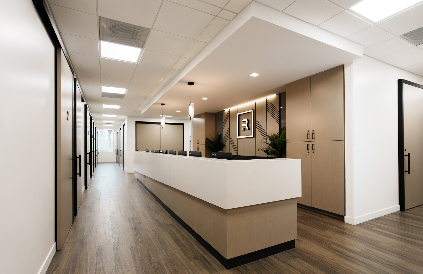 Major corridors at Revelus Dermatology are anchored by windows to reduce the enclosed, maze-like feeling common in many healthcare offices and help patients remain oriented throughout their visit.