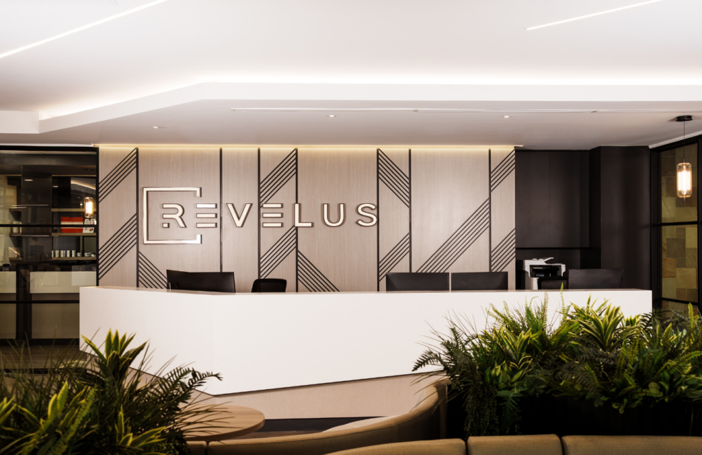 The reception area at Revelus Dermatology integrates the practice’s brand identity directly into the space, blending medical dermatology, aesthetics and retail offerings within a cohesive, hospitality-inspired patient experience.