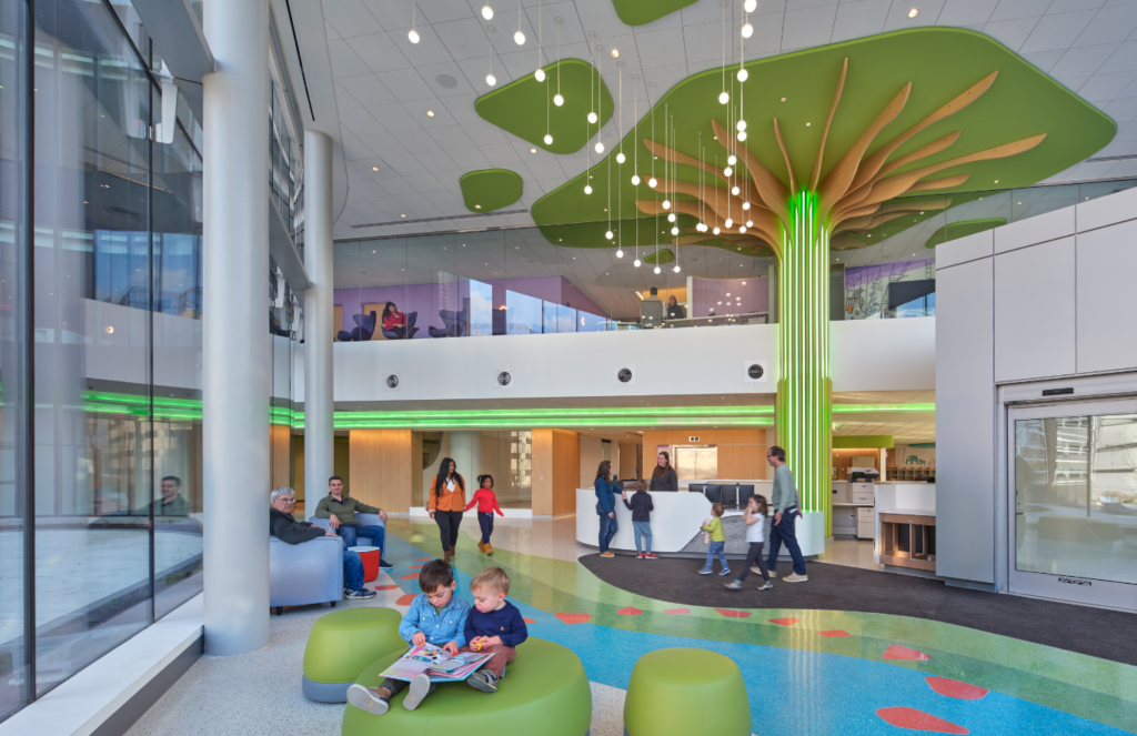 A towering two-story illuminated “Tree of Life” sculpture that greets visitors as they enter the expansive light-filled lobby.